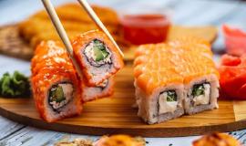 side-view-philadelphia-california-rolls-with-crab-meat-sour-cream-cucumber-tobiko-caviar-salmon-cream-cheese-soy-sauce-ginger-board_141793-5045.jpg