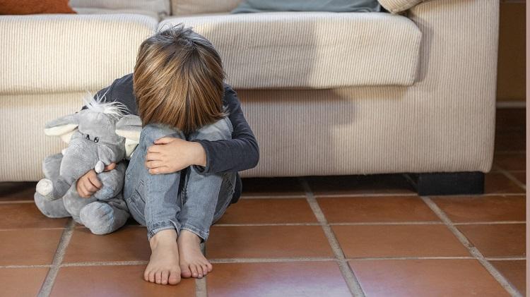 little-boy-outdoors-upset-holding-his-toy.jpg