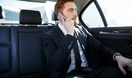 confident-bearded-businessman-talking-mobile-phone_171337-16218.jpg