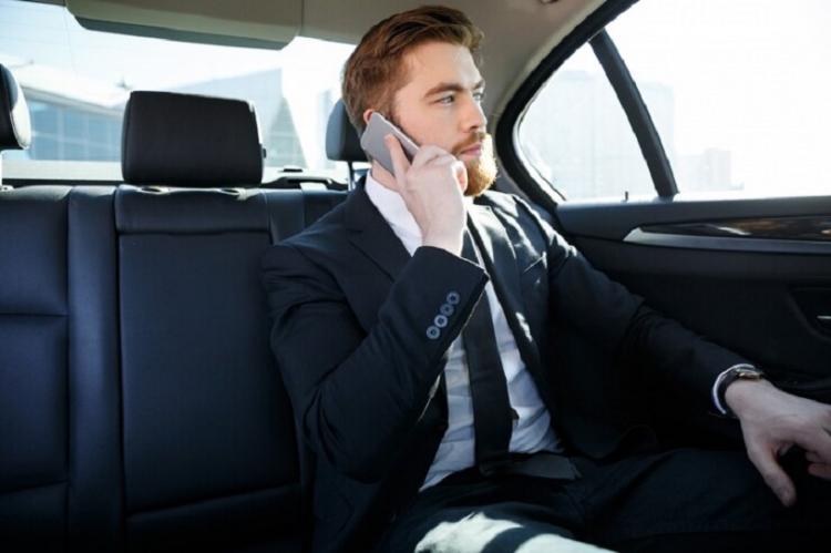 confident-bearded-businessman-talking-mobile-phone_171337-16218.jpg